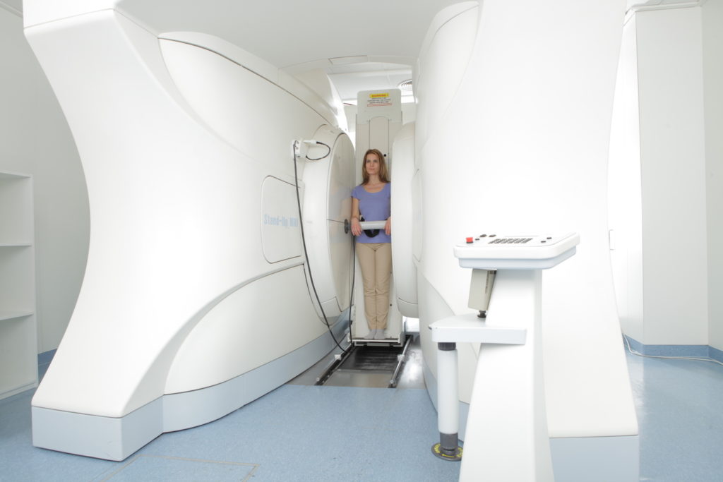 Woman in Medserena Upright Open MRI scanner - no claustrophobia